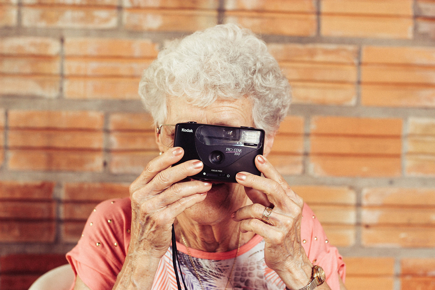 Elderly woman with a camera
